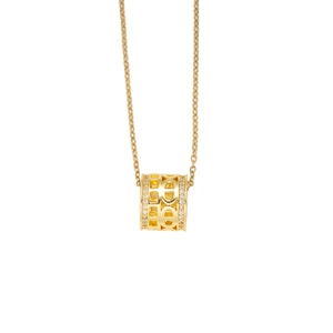 Luxe gold cylinder necklace with hollow design and zircon pavé setting on white background