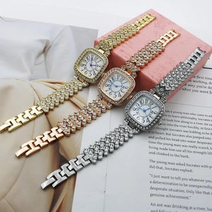 Detailed view of square quartz watches in gold, rose gold and silver with rhinestones