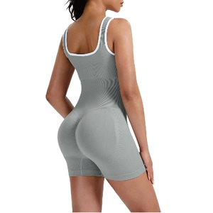 Detailed view of grey seamless bodysuit with U-neckline and white contrast piping