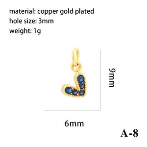 Detail of 18K gold plated heart charm with blue zircon and 9mm by 6mm dimensions