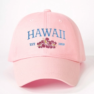 Close-up of Hawaii Est 1959 embroidery with hibiscus flower on pink cotton baseball cap