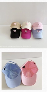 Detail view of cotton baseball caps with heart embroidery and adjustable metal buckle
