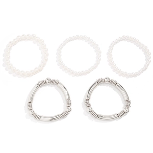 Detail view of five-piece multilayer bracelet set with pearls and silver metal tubes