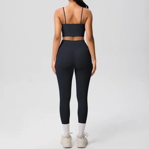 Rear view of black two-piece yoga set featuring thin strap bra and high waist leggings