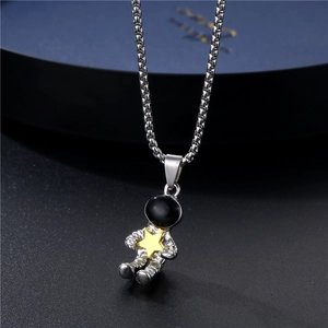 Classic astronaut pendant necklace in silver with a gold star and sleek box chain