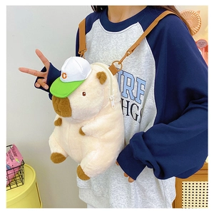 Detail of Capybara plush crossbody bag wearing a baseball cap with soft fur texture