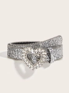 Close-up of silver glitter belt featuring a heart buckle with sparkling rhinestones