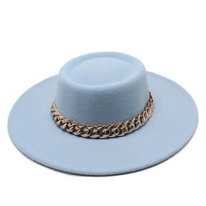 Detail of light blue wool felt boater hat featuring a decorative gold chunky metal chain