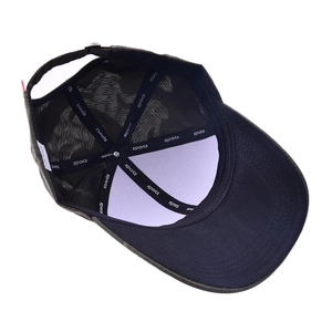 Detail view of camouflage baseball cap interior with reinforced seams and sports tape