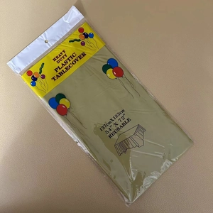 Detail of gold heavy duty reusable plastic tablecover in 137x183cm product packaging