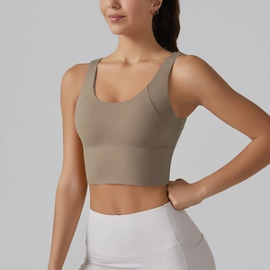 Detailed front view of high-elastic light brown sports bra with supportive wide hemline