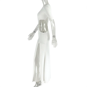 Close-up of side waist cutout and thigh-high slit on a white fitted maxi dress