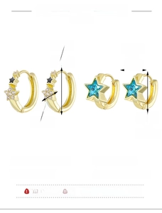 Detailed view of gold copper hoop earrings with zircons and black star charms with dimensions
