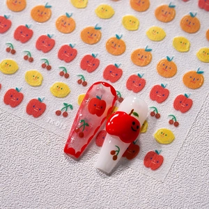 Japanese style fruit nail stickers with mini apples and oranges on white background