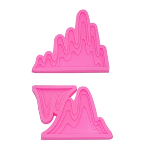 Pink silicone mold featuring mountain landscape shapes for cake and chocolate decorating