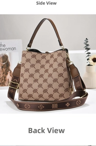 Detail view of monogram bucket bag with vintage pattern and wide fabric shoulder strap