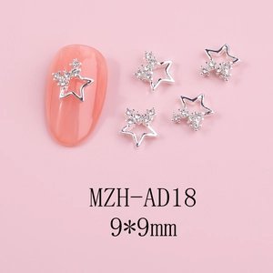 Detailed macro view of 9x9mm silver star nail charms with tiny rhinestone accents