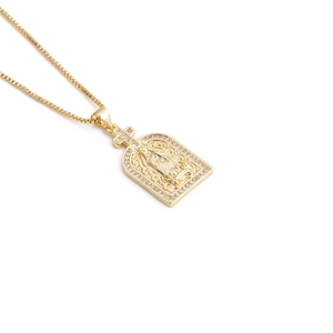 Gold pendant necklace with embossed religious figure and sparkling crystal accents