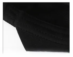 Macro view of wide cotton sweatband with reinforced stitching inside the black flat cap