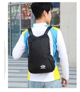 Detail of lightweight black waterproof hiking backpack with VANAHEIMR brand logo