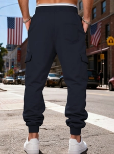 Rear view of heavy fleece cargo joggers with drawstring waist and deep utility pockets