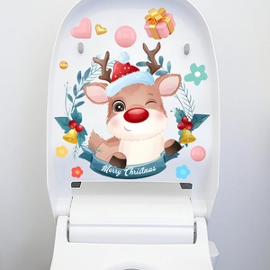 Detail of Christmas reindeer toilet lid sticker with Merry Christmas greeting and floral wreath