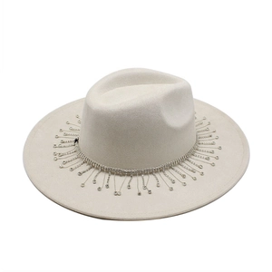 Detailed view of rhinestone fringe band on beige wide brim suede bridal fedora hat