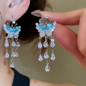 Elegant butterfly drop earrings with blue zircon tassels for a luxury fashion jewelry look