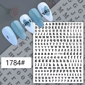 Classic black alphabet nail art stickers showing uppercase and lowercase letters on blue nails