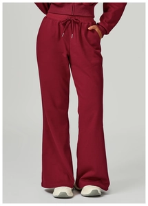 Wide-leg burgundy drawstring sweatpants featuring a high-waisted fit and soft knit fabric