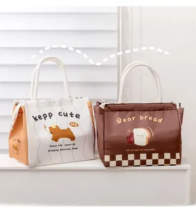 Detail of insulated lunch bags with cute prints, waterproof canvas and rope handles
