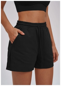 Detail view of high waist black athletic shorts with adjustable drawstring and side pockets
