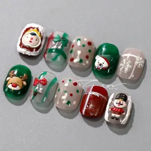 Macro shot of 3D embossed Christmas nail art stickers with reindeer and nutcracker details