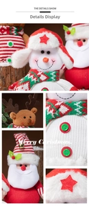 Close-up showing knit textures and decorative bells on festive Christmas plush dolls