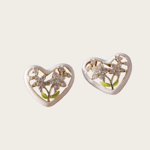 Elegant heart-shaped flower stud earrings with white enamel and green zircon accents