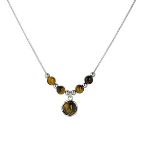 Silver necklace with tiger eye stone beads and round pendant on a white background