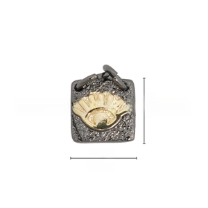 Macro detail of a 9.1mm square 18k gold plated pendant with textured finish