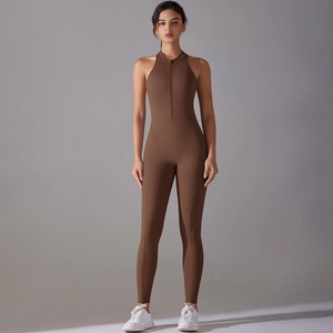 Detail of coffee brown one-piece yoga jumpsuit with half-zipper and racerback design
