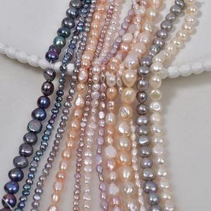 Detailed view of multicolored baroque and rice pearls for DIY jewelry making