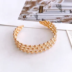 Three-layer gold beaded open bangle bracelet with a polished finish for women