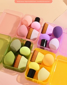 Macro view of 4-piece makeup tool set with foundation brush and sponges in a storage box