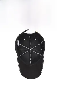 Detail of baseball cap interior with FBKS stitched tapes and adjustable metal buckle