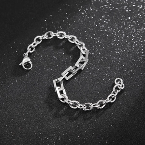 Close-up of silver stainless steel curb chain with geometric rectangular link details