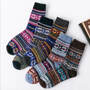 Detail shot of five pairs of vintage ethnic style wool blend winter socks with patterns