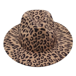 Detailed close-up of brown leopard print pattern and felt texture on a fedora hat