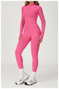 Detail of pink slim fit yoga jacket with stand collar and thumbhole sleeves for women