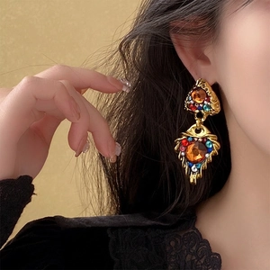 Vintage gold-toned triangle earrings with amber stone and colorful crystal accents