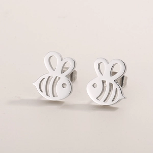 Macro shot of silver insect bee stud earrings with polished minimalist hollow design