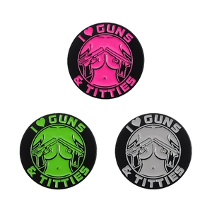 Enamel brooch set with I heart Guns & Titties text and geometric round design