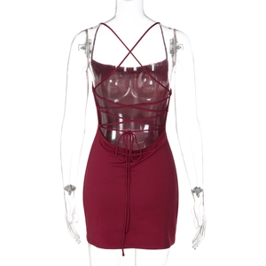 Detail view of deep red backless mini dress with intricate criss-cross straps and ruching